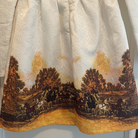 White mini long sleeved dress with horse and carriage details at the bottom - Picture 5 of 5
